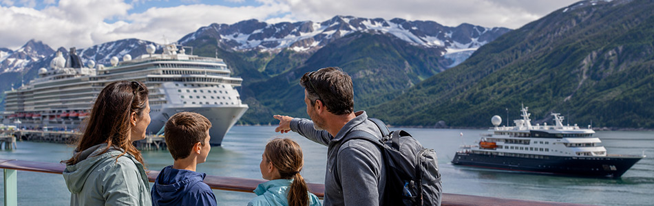 Family enjoying glacier views and whale watching from a large Alaska cruise ship with breathtaking mountain scenery.