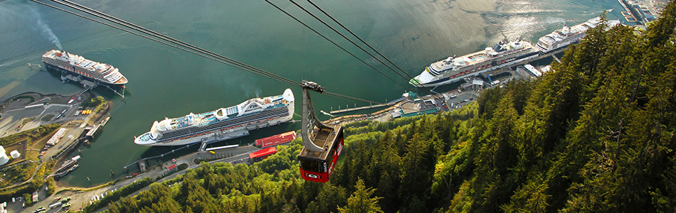 Ketchikan cruise ships and aerial tram overlooking the scenic Alaska waterfront.