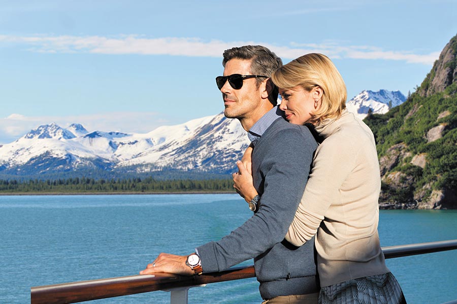 Couple enjoying Alaska rail journey on Regent Cruises